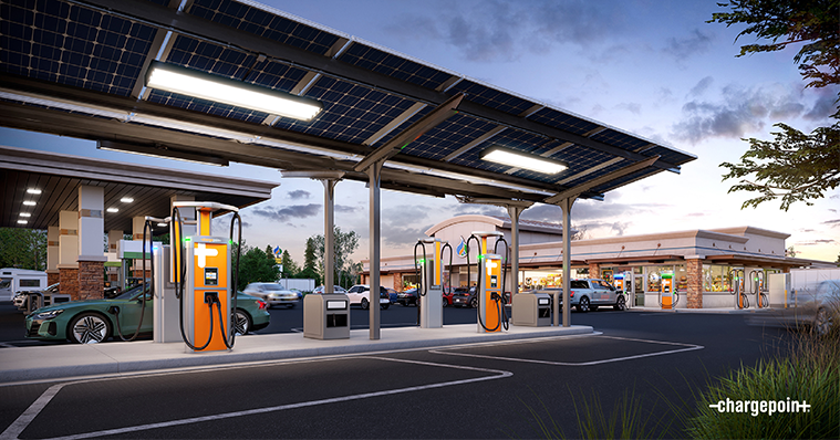 Electric charging stations alongside gas pumps at a fueling station.